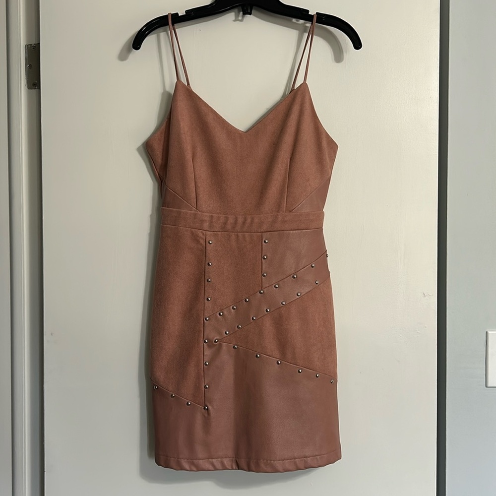 Pink faux suede and faux leather dress with silver studs. Zipper in the back.